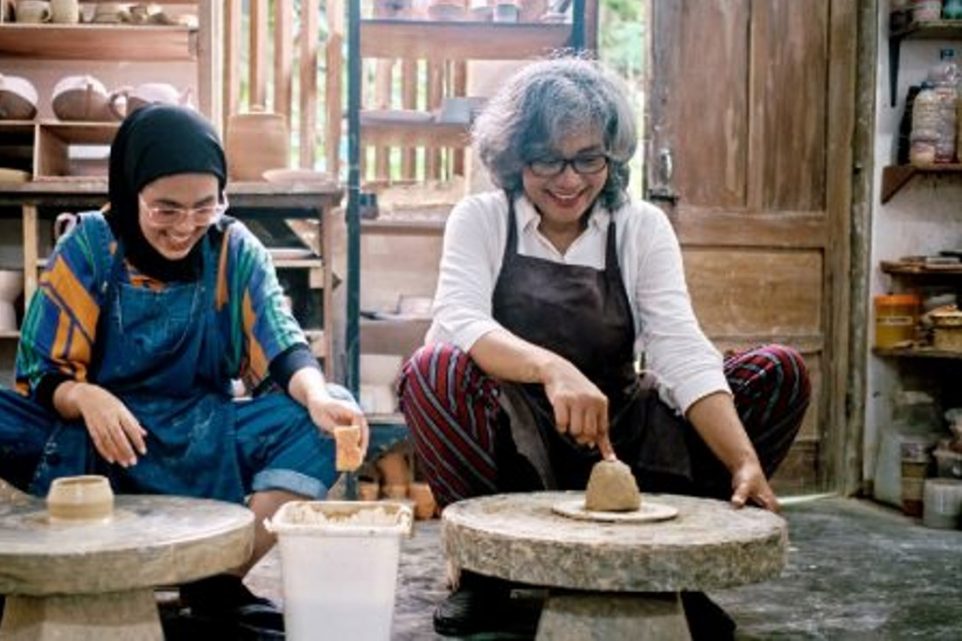 Young Woman Potter Teaching The Art of Pot Making