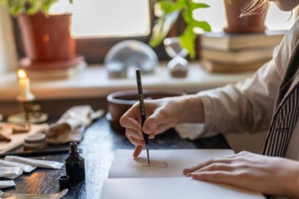 Female Artist Drawing with Ink Using Dip Pen, Creativity and Inspiration