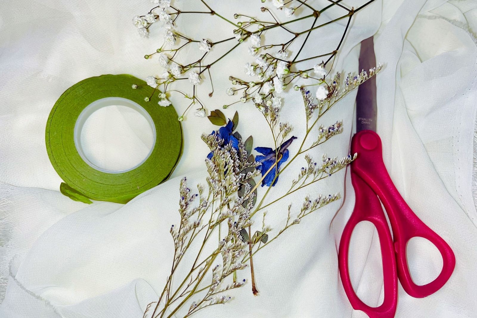 dried flowers and floral tape with scissor