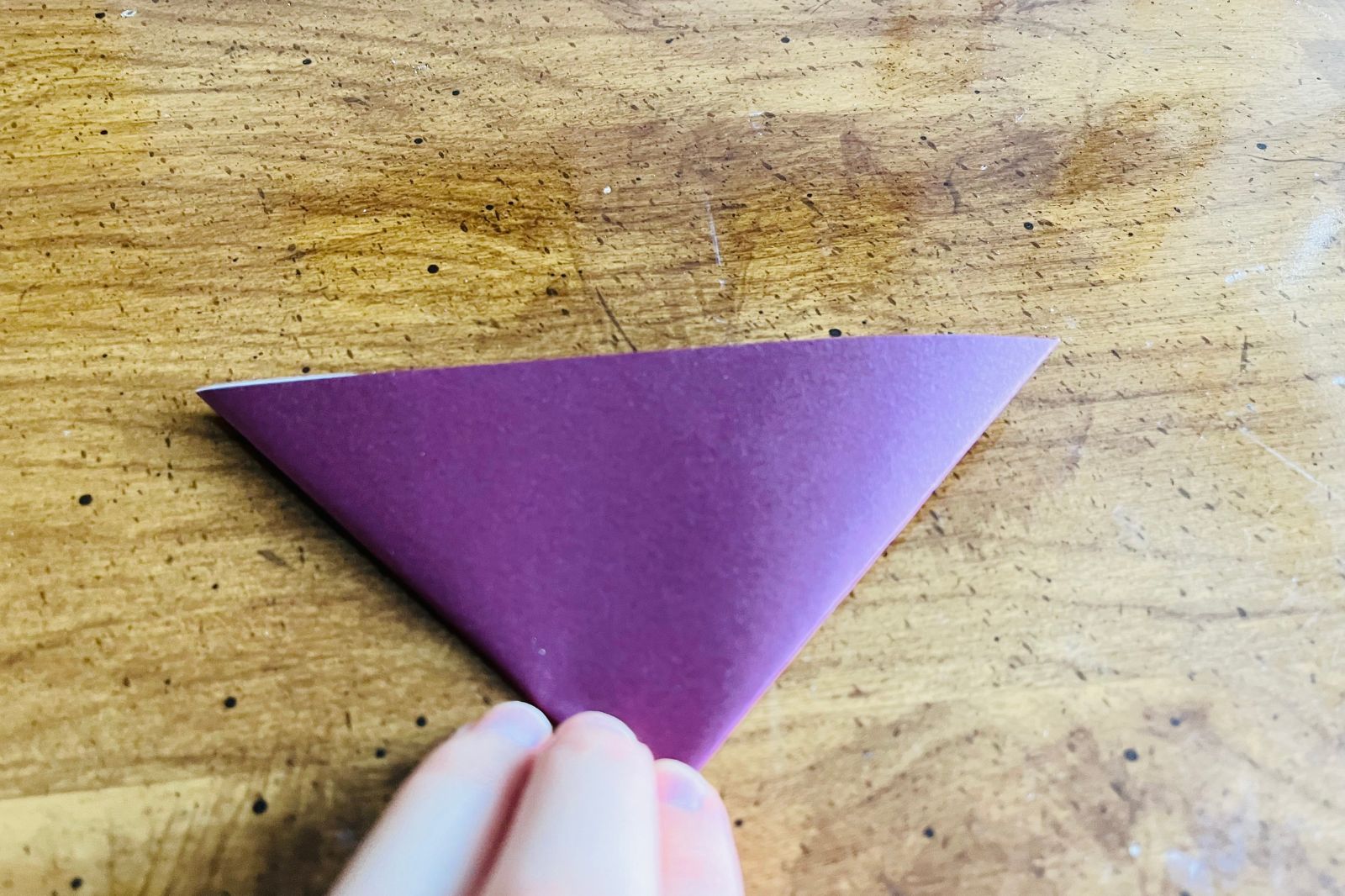 origami heart being folded