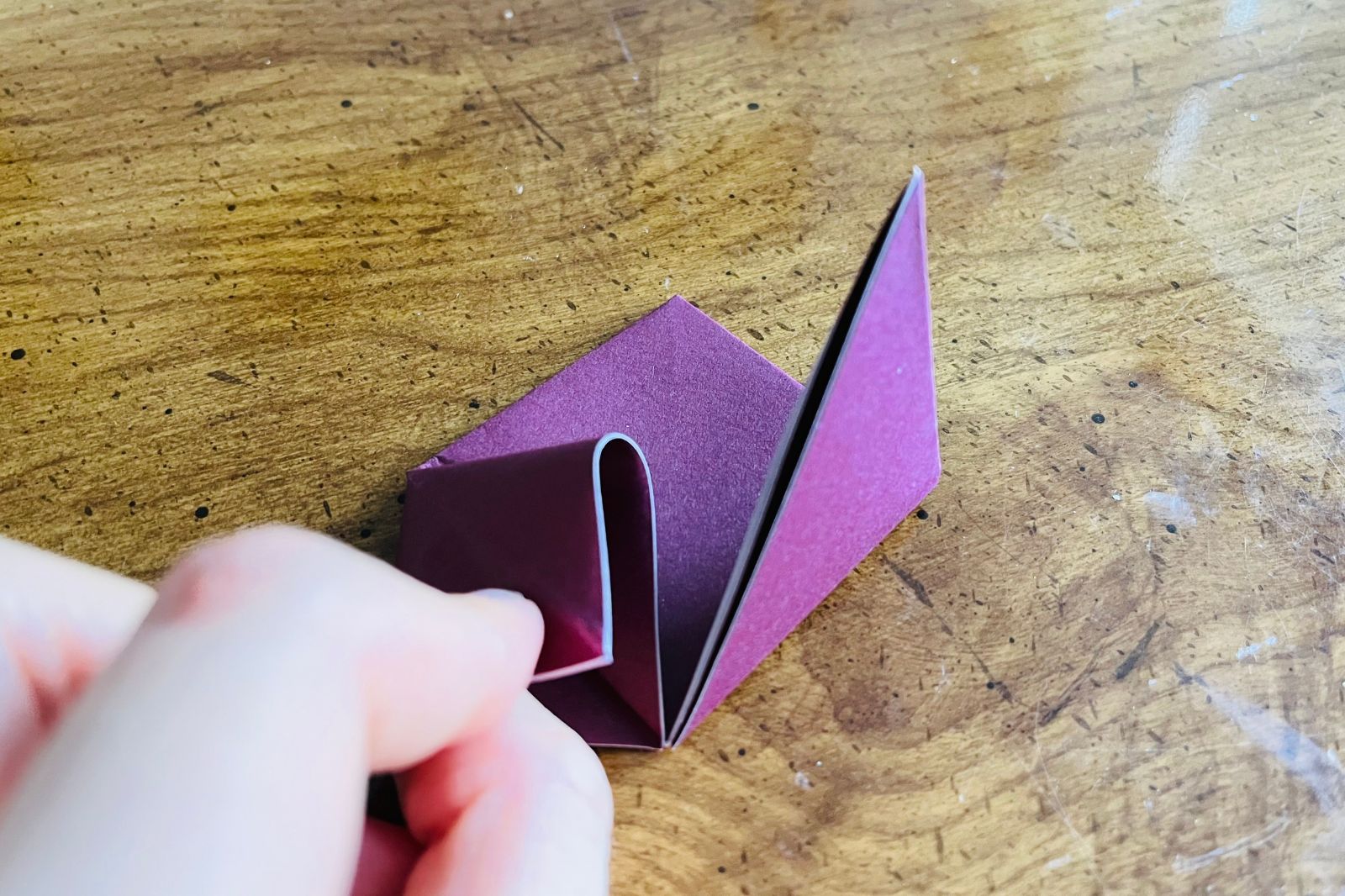 origami heart being folded