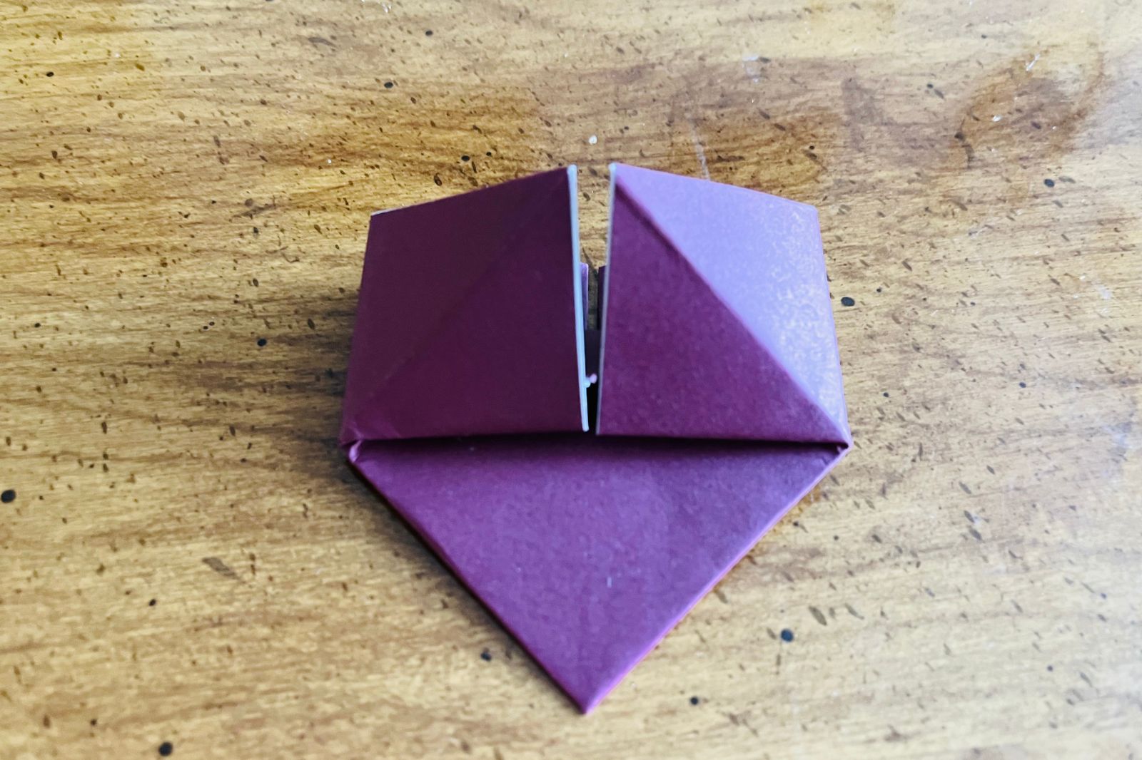 origami heart being folded