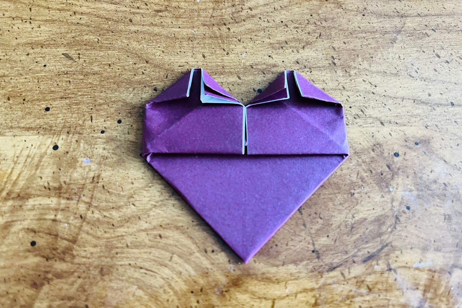 origami heart being folded