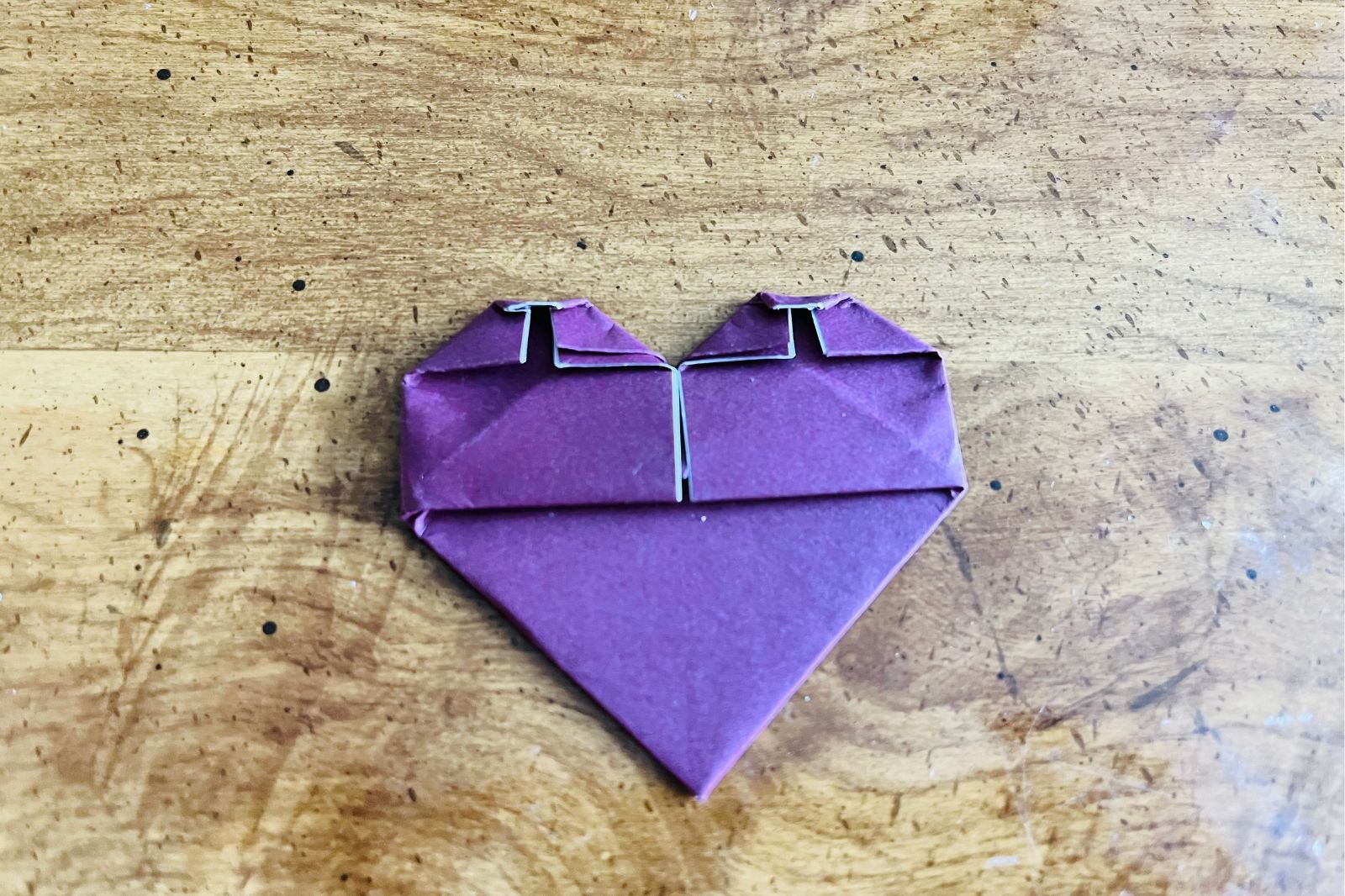 origami heart being folded